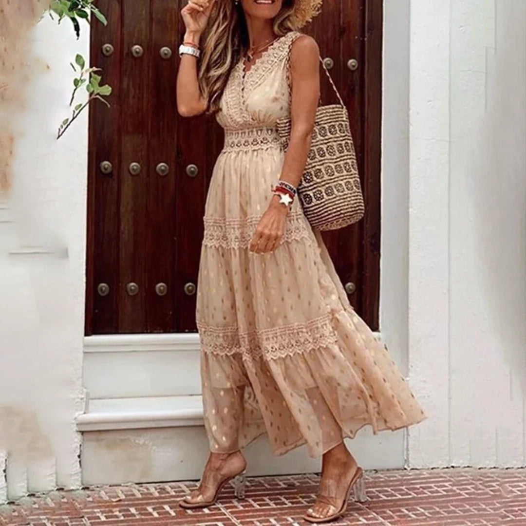 Beige lace bohemian maxi dress, sleeveless and lightweight, suitable for summer wear, displayed on a standing model.