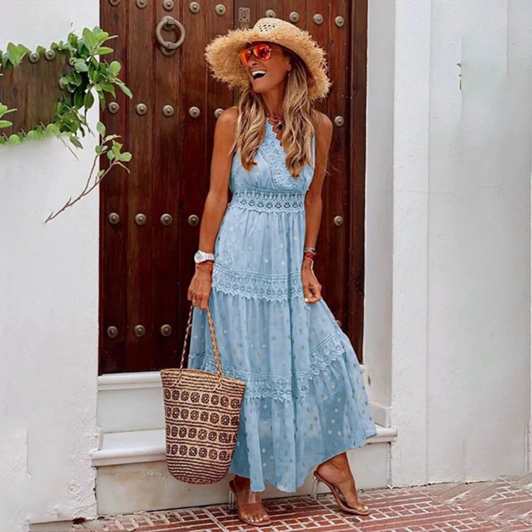 A sleeveless beige lace bohemian maxi dress, lightweight and perfect for summer, displayed on a mannequin.