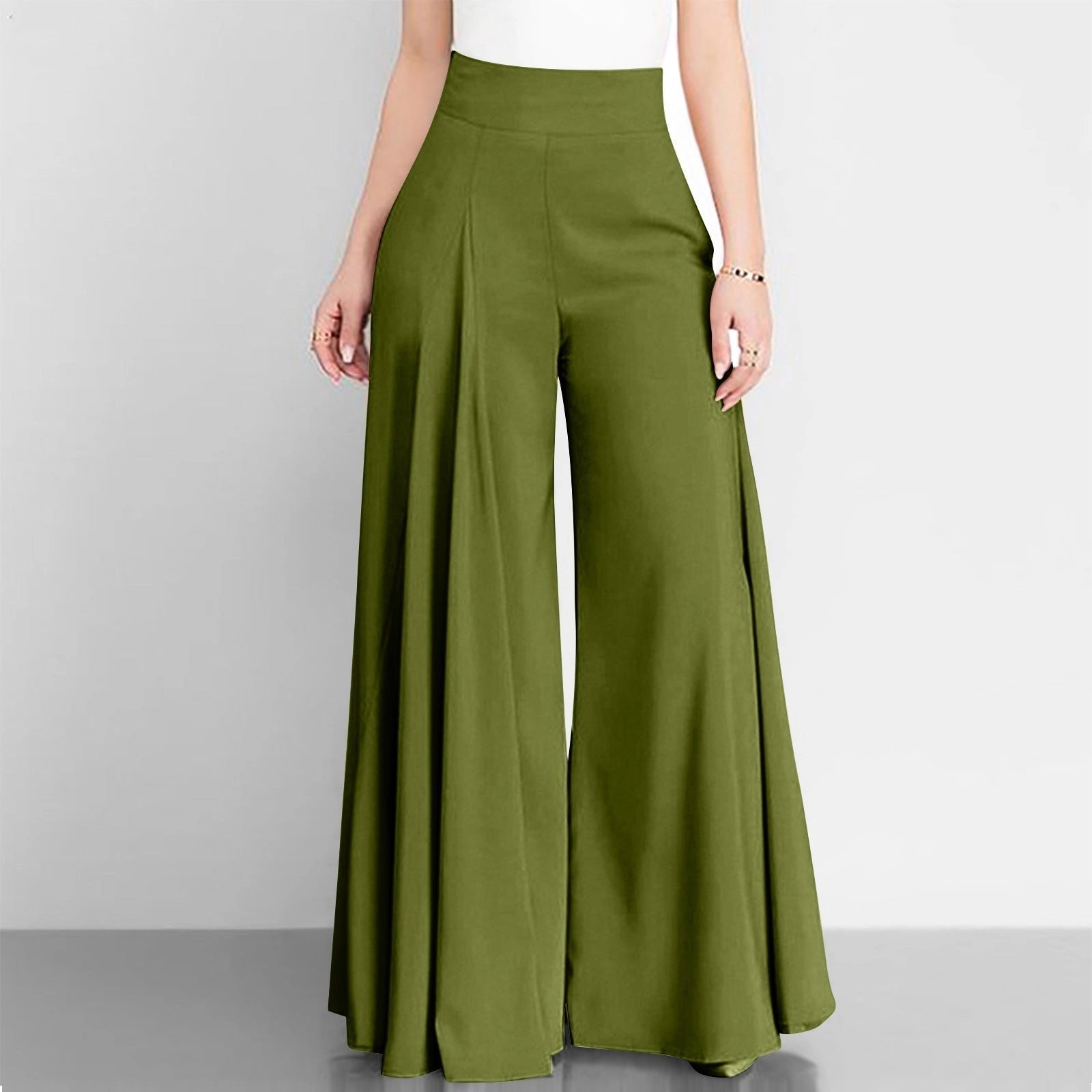 A woman wearing Elegant High-Waist Camel Palazzo Pants paired with a green top, showcasing the chic office workwear ensemble.