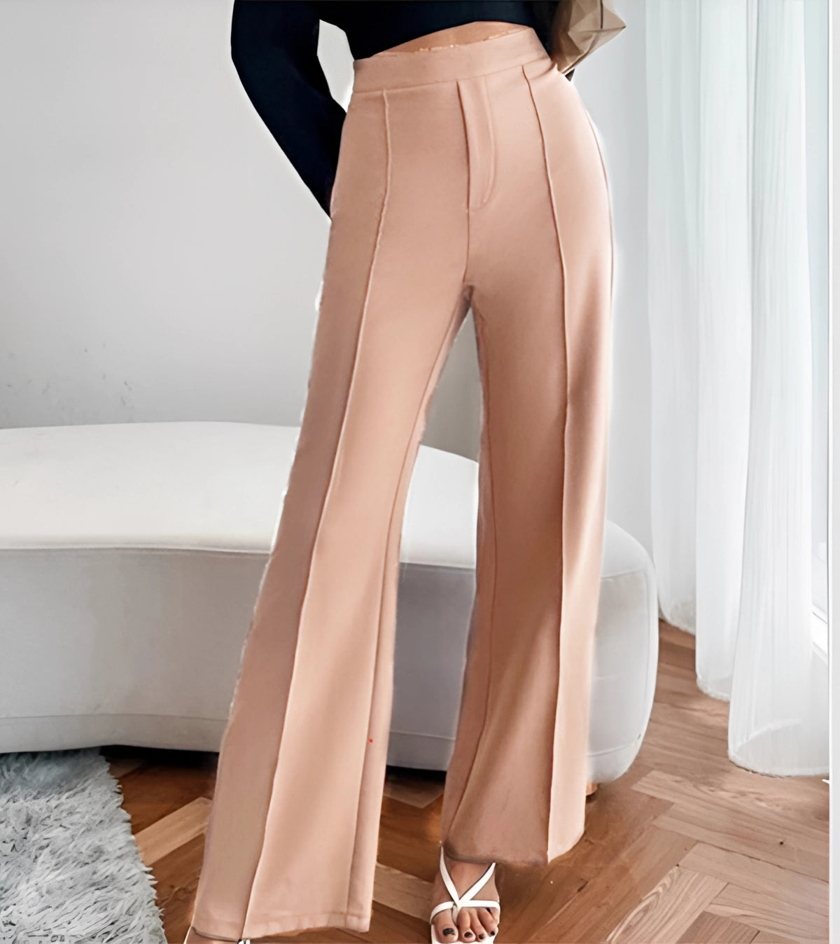 Woman wearing high-waist flared beige trousers in size 4XL, tailored fit office wear, showing full body view with emphasis on waist and legs.