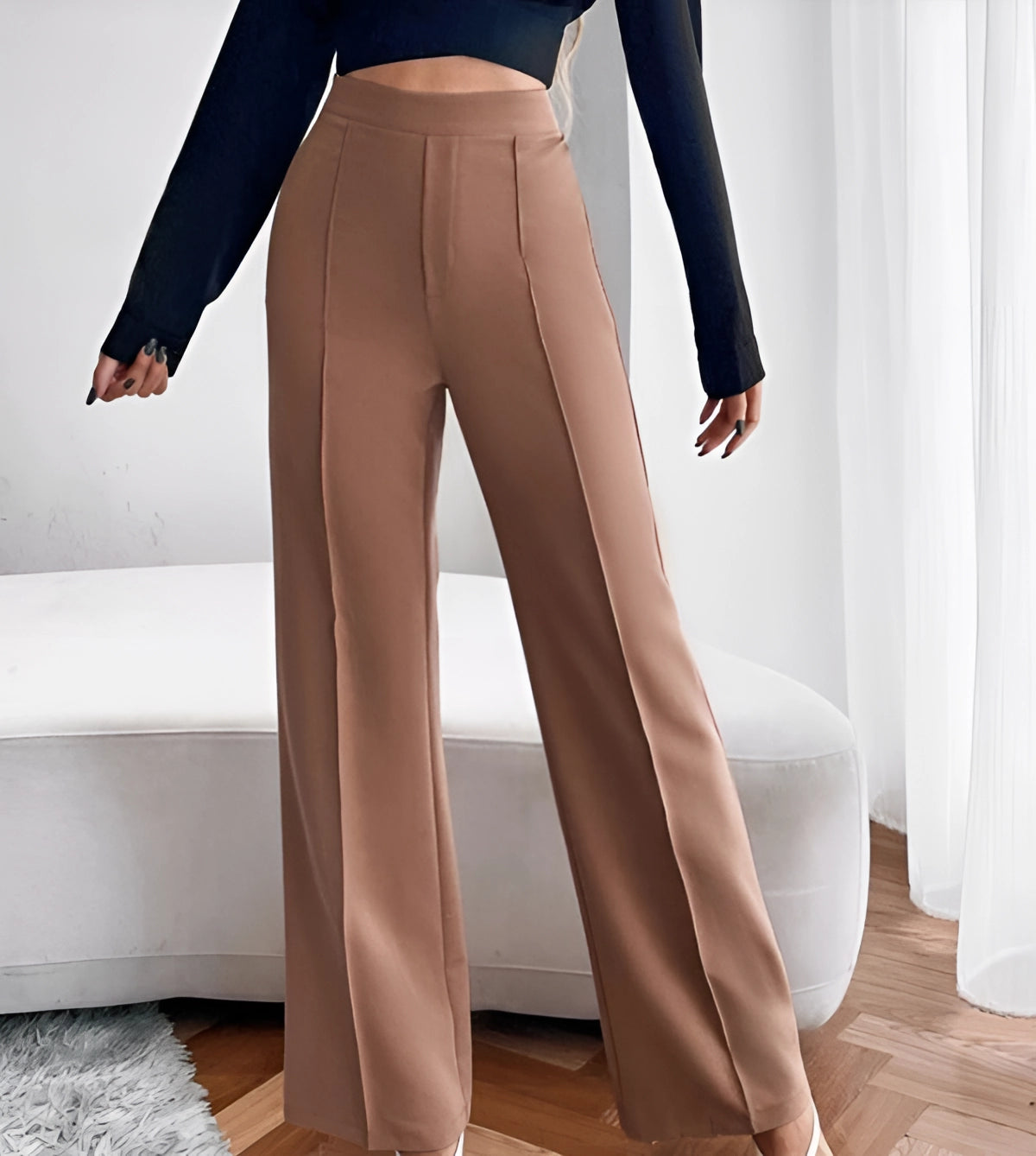 High-waist flared beige trousers for women, tailored fit, seen from the waist down, showcasing comfort and a stylish office wear look.