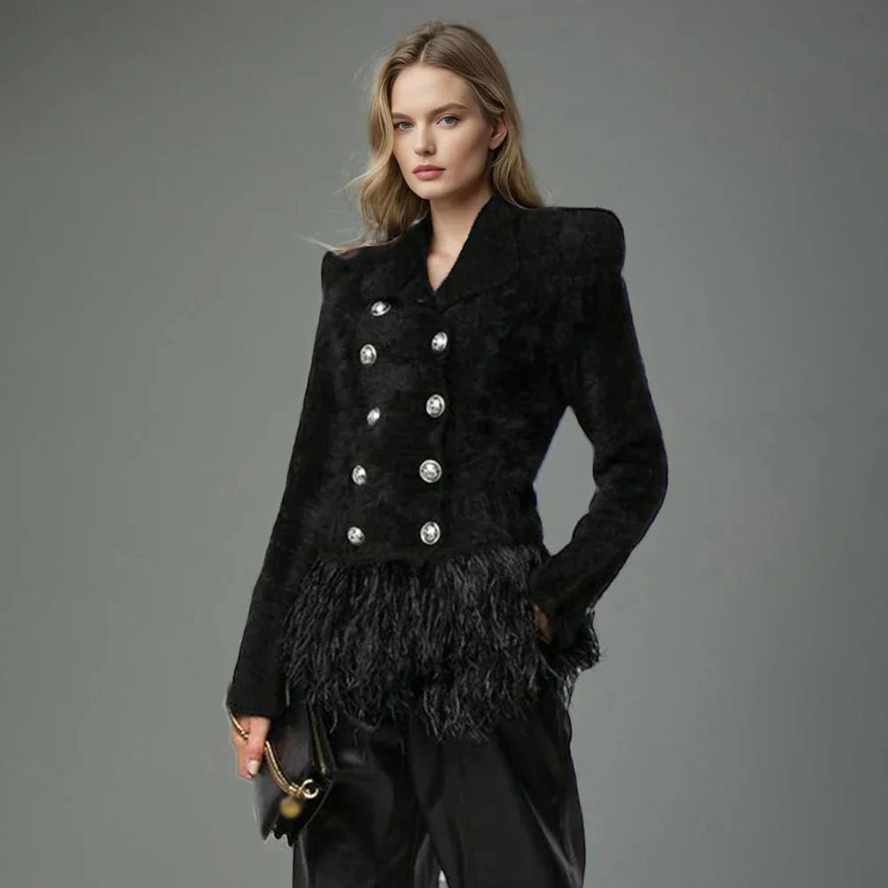 Luxury Women's Velvet Blazer with Feather Trim, Double-Breasted, Black, worn by fashion model showing shoulder and arm detailing, waist-length design, elegant collar and sleeves.