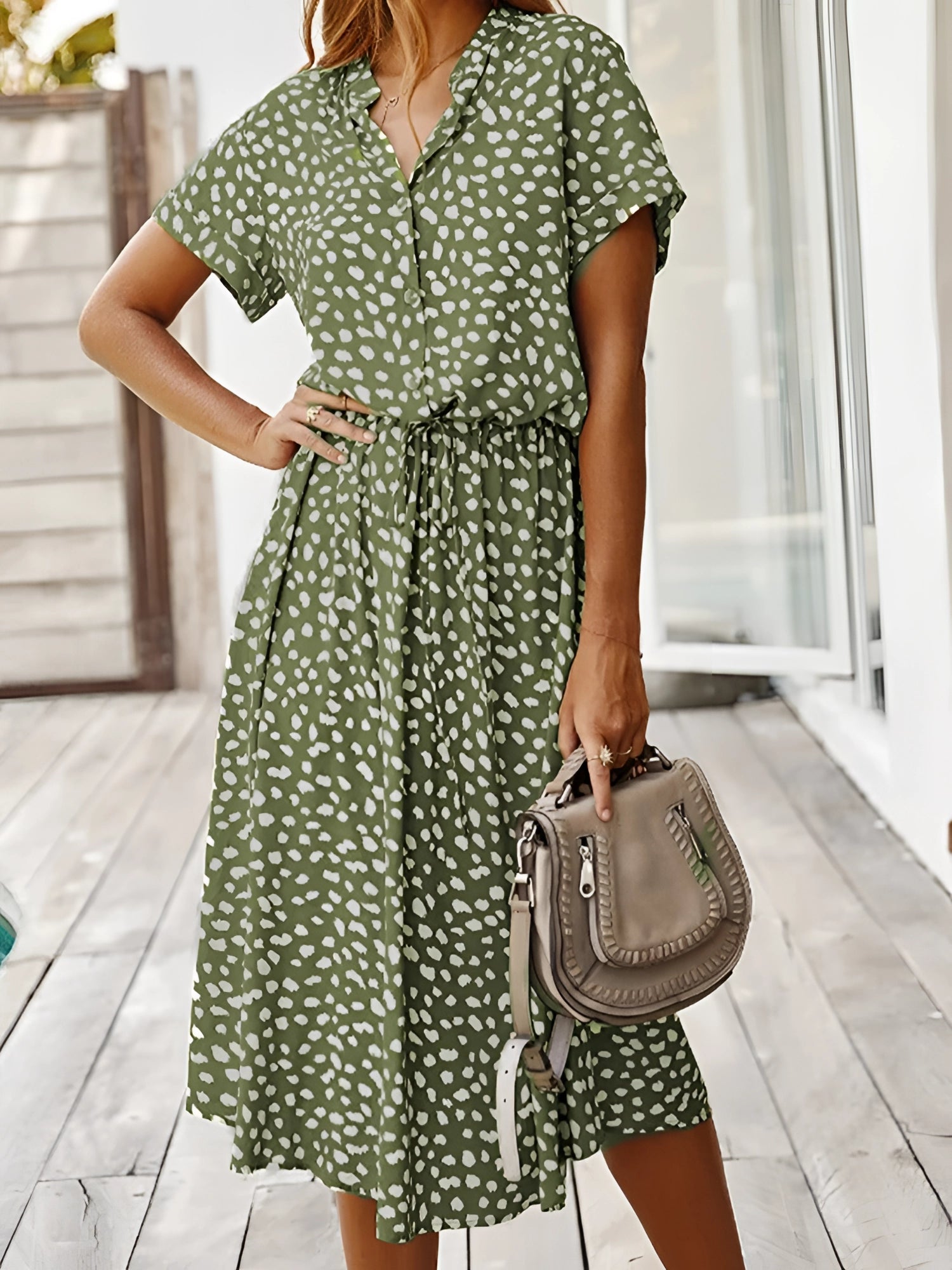 White polka dot midi dress with short sleeves and tie waist, lightweight summer fabric, displayed on a green 3XL variant.