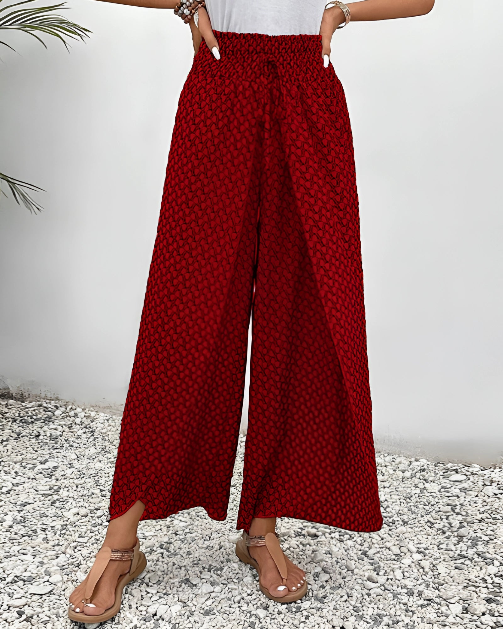 Red high-waisted palazzo pants with ethnic patterns, ideal for summer boho beachwear.