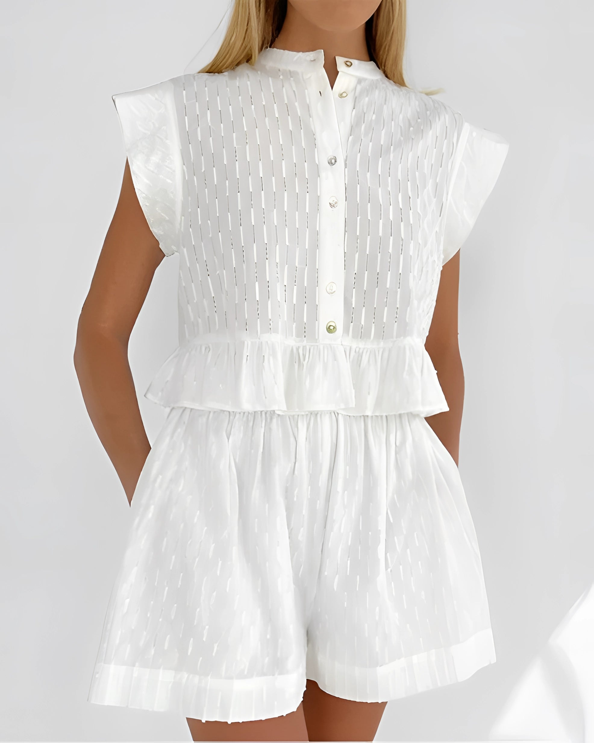 White puff sleeve romper with textured button front, peplum waist, and chic summer design in size L.